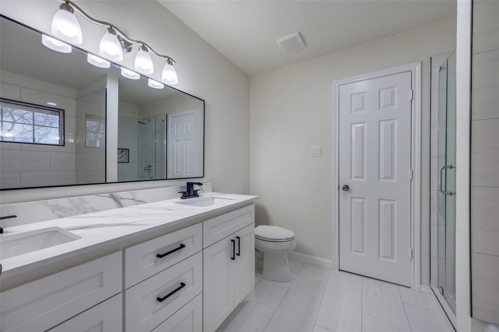 471 Meadowview Circle Van Alstyne, TX 75495 - Photo 30 of 39 a bathroom with a granite countertop sink mirror and toilet