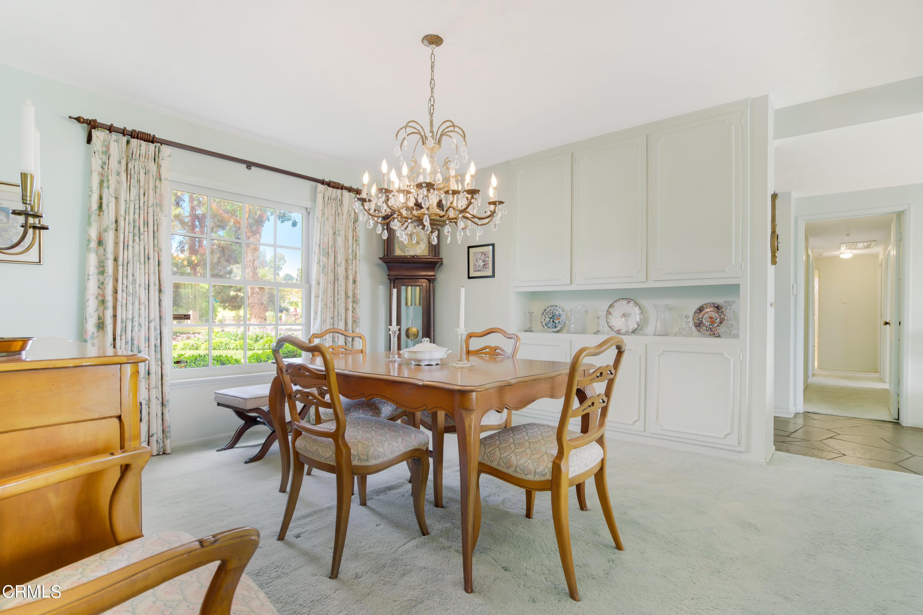 1387 Fairway Drive Camarillo, CA 93010 - Photo 11 of 51 a view of a dining room with furniture a chandelier and large windows