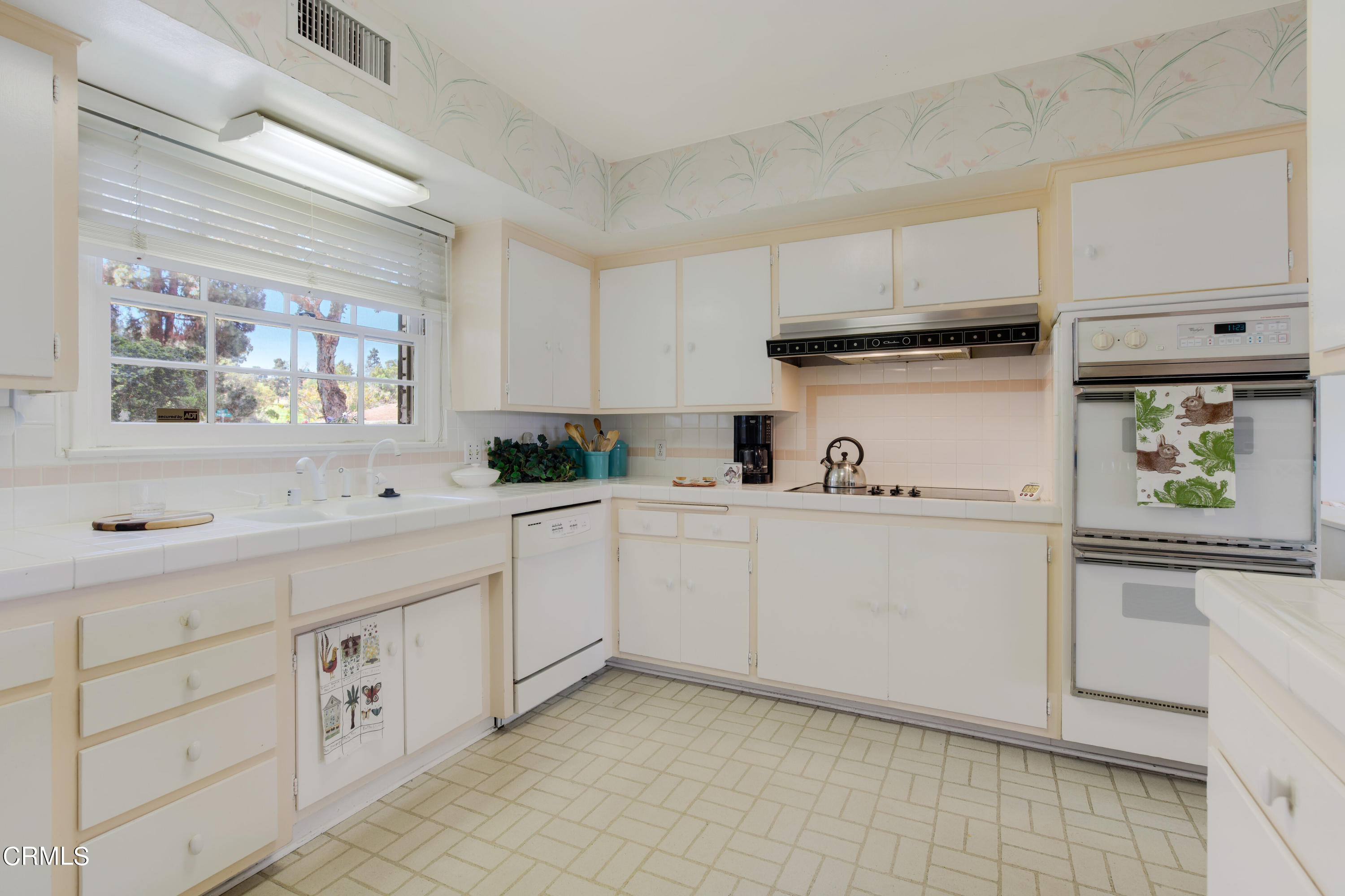 1387 Fairway Drive Camarillo, CA 93010 - Photo 22 of 51 a kitchen with cabinets appliances a sink and a window