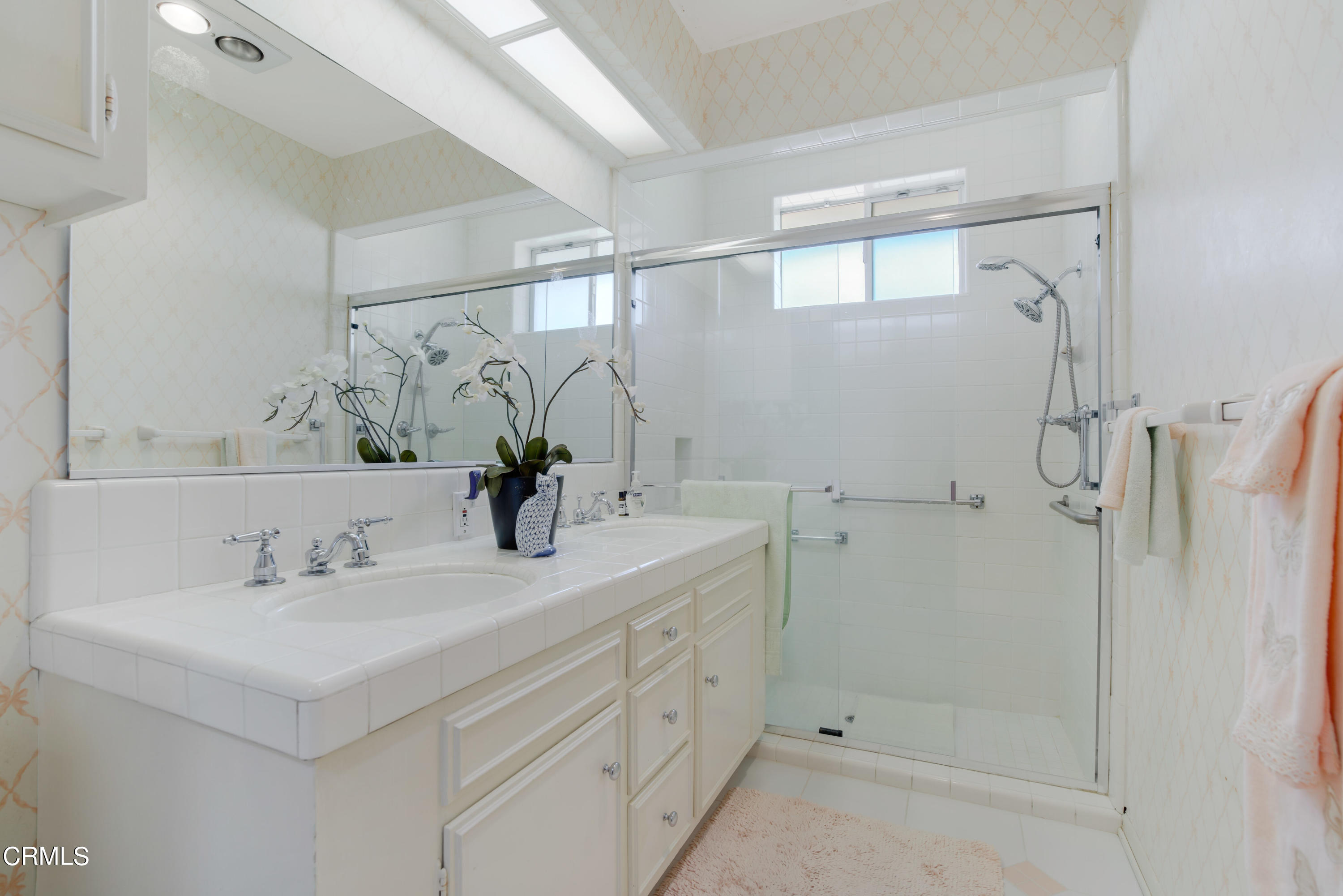 1387 Fairway Drive Camarillo, CA 93010 - Photo 26 of 51 a bathroom with a shower sink vanity and mirror