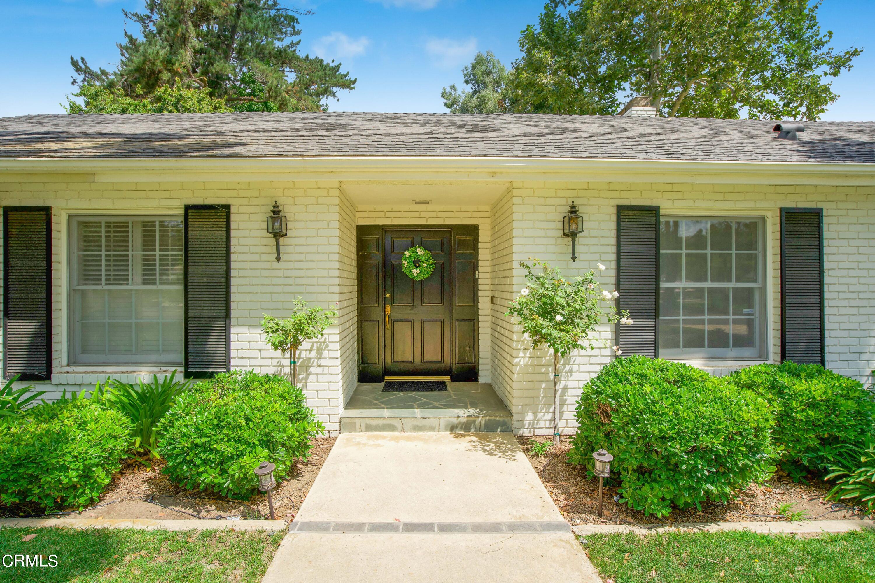 1387 Fairway Drive Camarillo, CA 93010 - Photo 4 of 51 front view of a brick house with a large window
