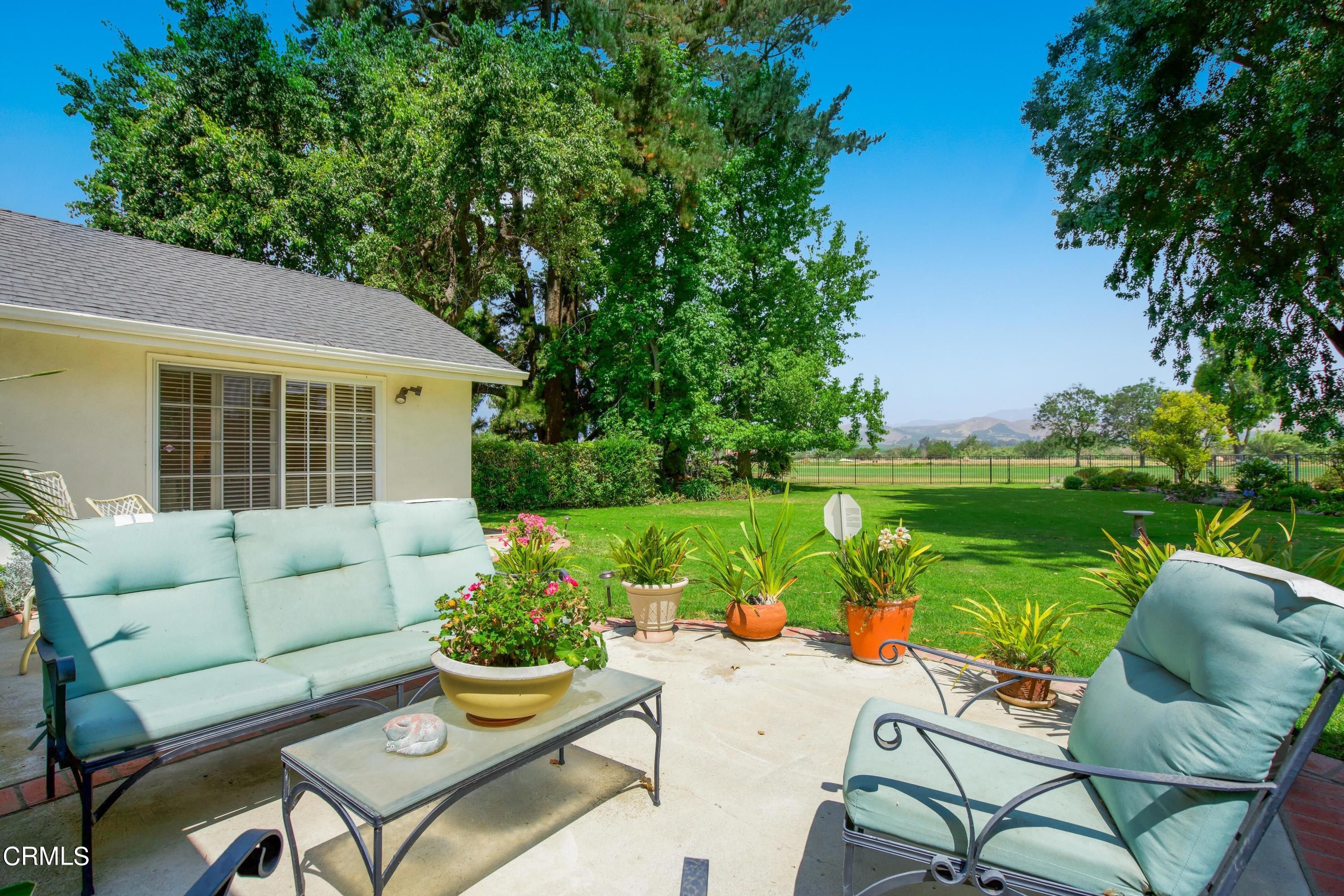 1387 Fairway Drive Camarillo, CA 93010 - Photo 34 of 51 a view of a patio with couches potted plants and a big yard