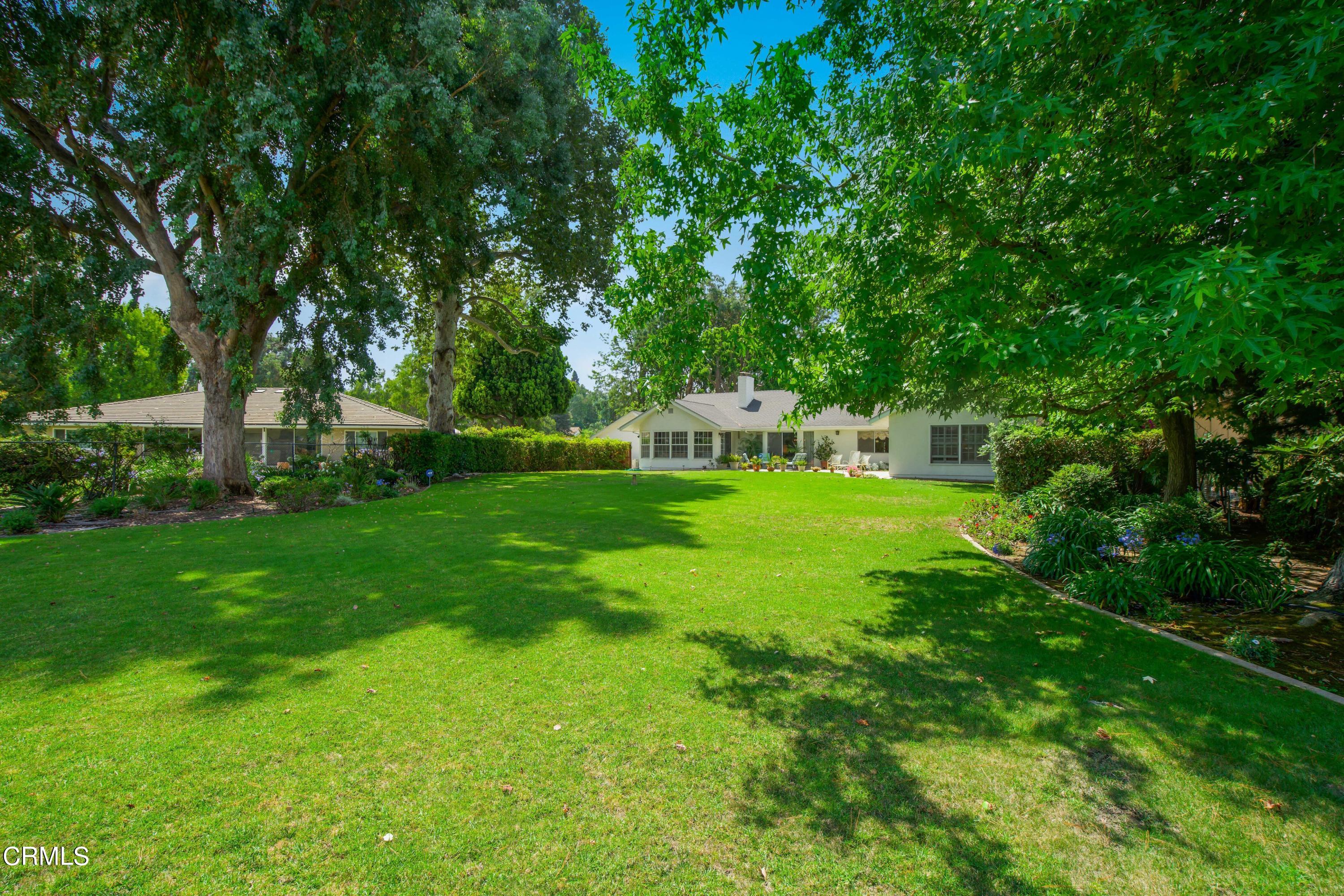 1387 Fairway Drive Camarillo, CA 93010 - Photo 38 of 51 a view of a house with a big yard and large trees