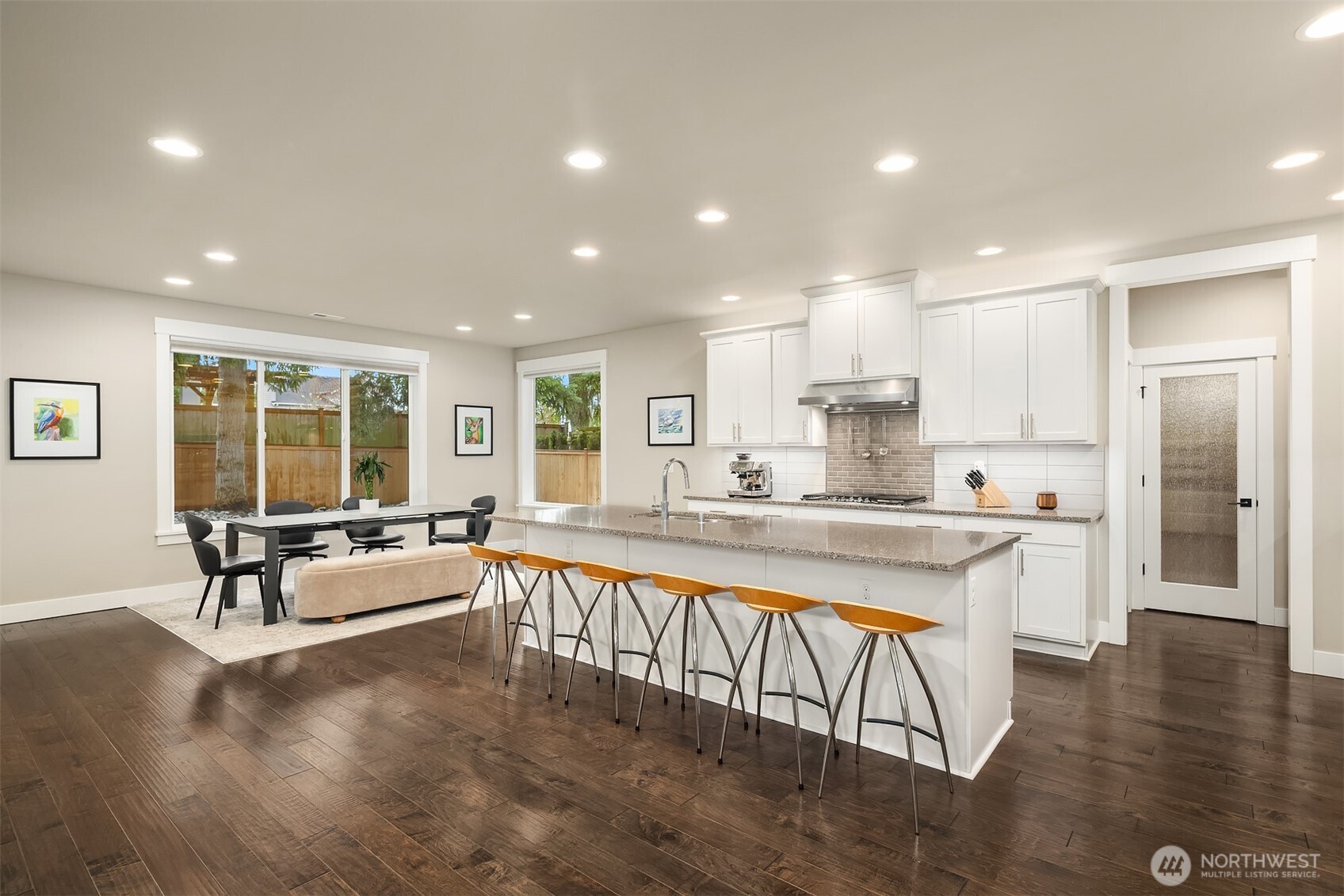 1435 242nd Place Southeast Bothell, WA 98021 - Photo 15 of 40 a large white kitchen with a large window and stainless steel appliances