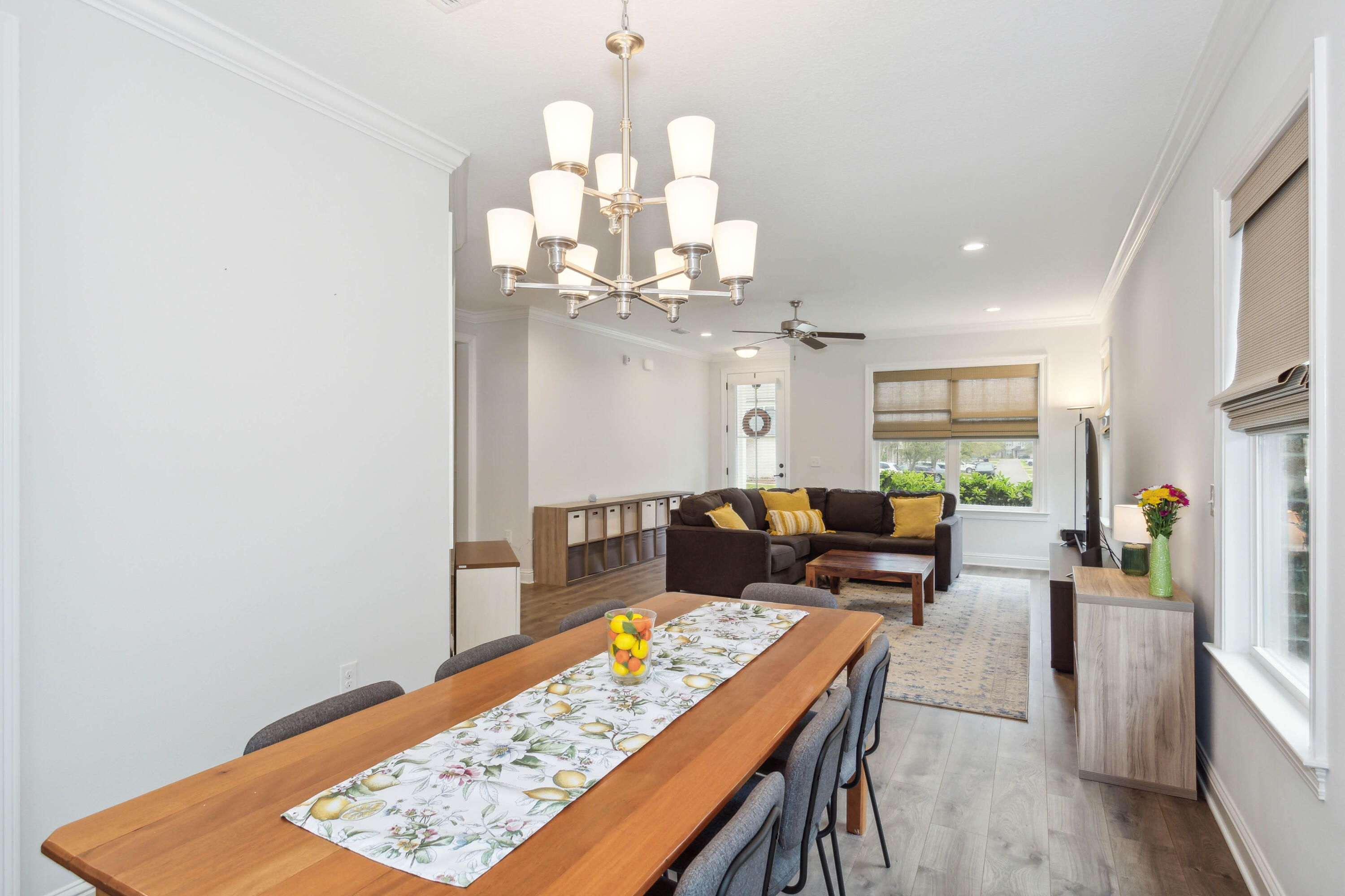 159 Laurel Oaks Drive Freeport, FL 32439 - Photo 13 of 34 a living room with furniture and a chandelier