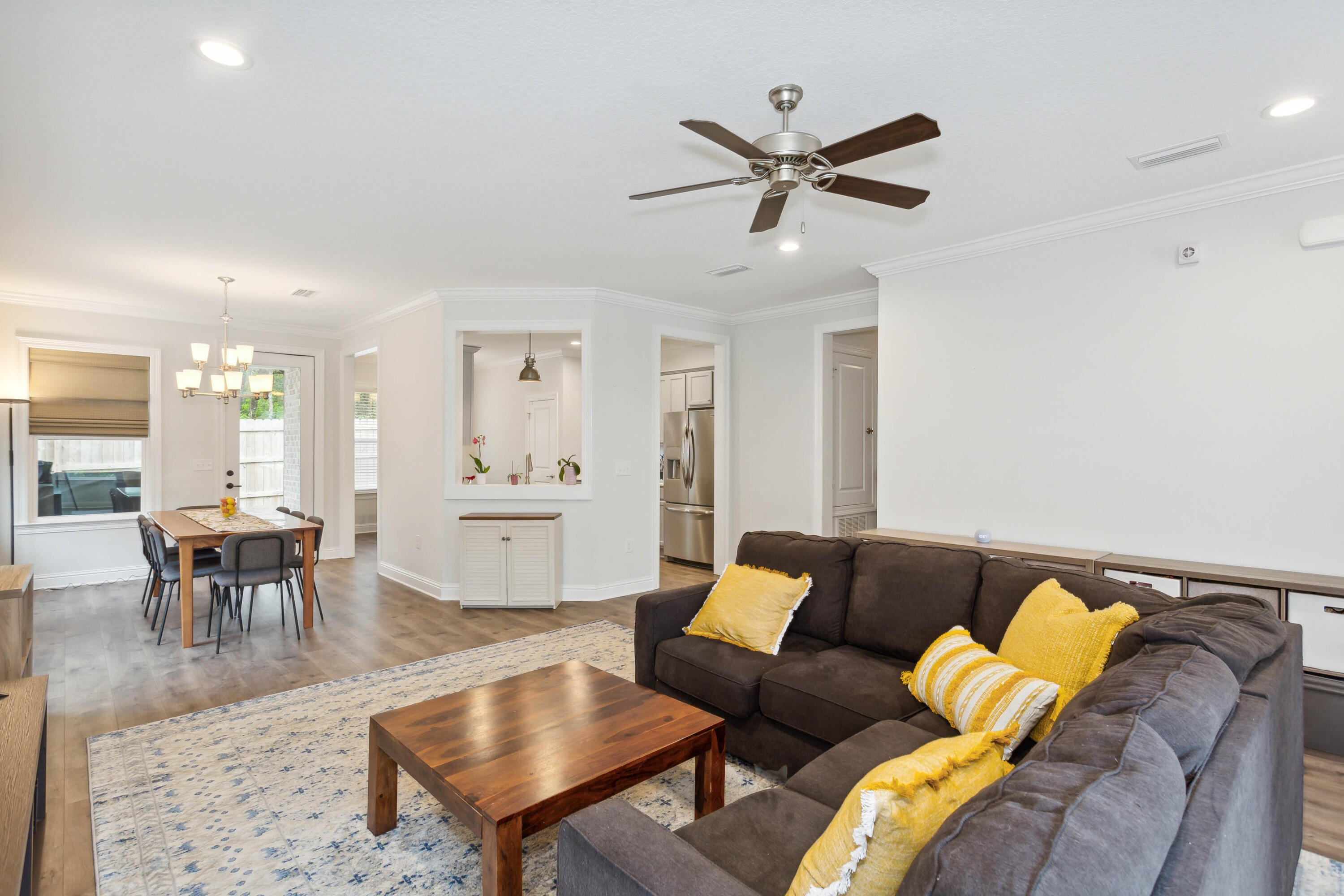 159 Laurel Oaks Drive Freeport, FL 32439 - Photo 15 of 34 a living room with furniture and a dining table