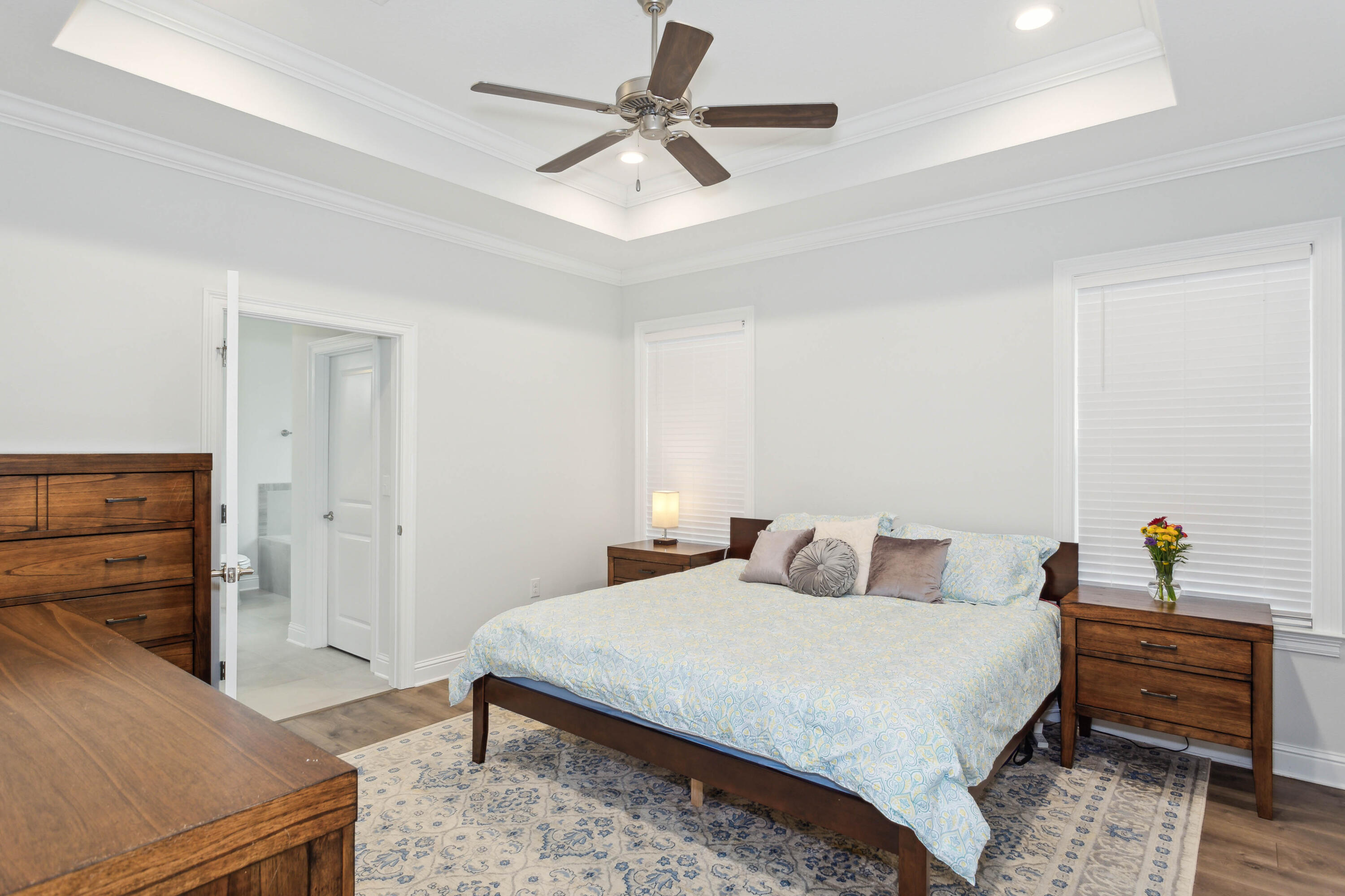 159 Laurel Oaks Drive Freeport, FL 32439 - Photo 19 of 34 a bedroom with a bed and cabinets