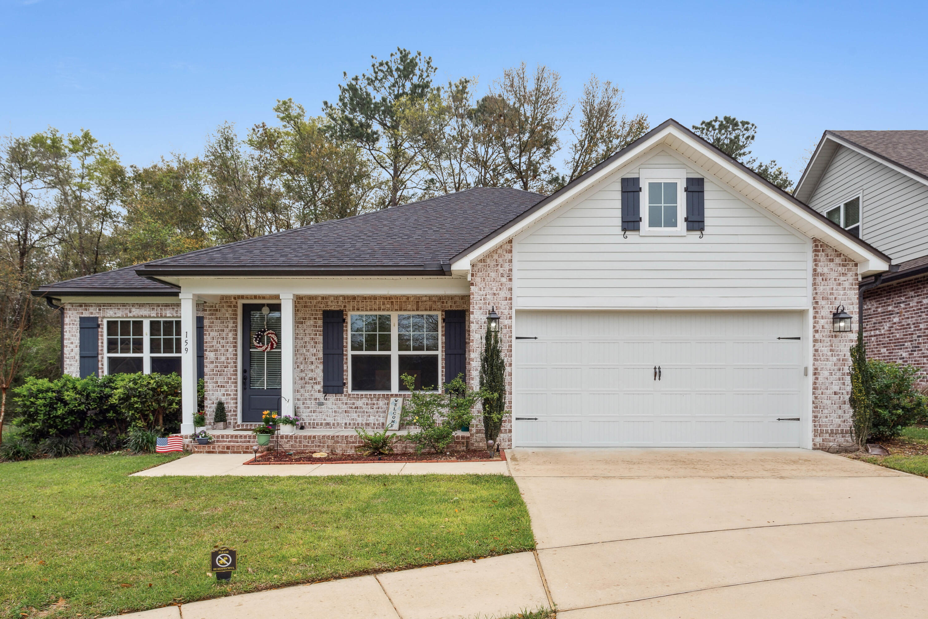 159 Laurel Oaks Drive Freeport, FL 32439 - Photo 2 of 34 a view of a house with backyard and garden