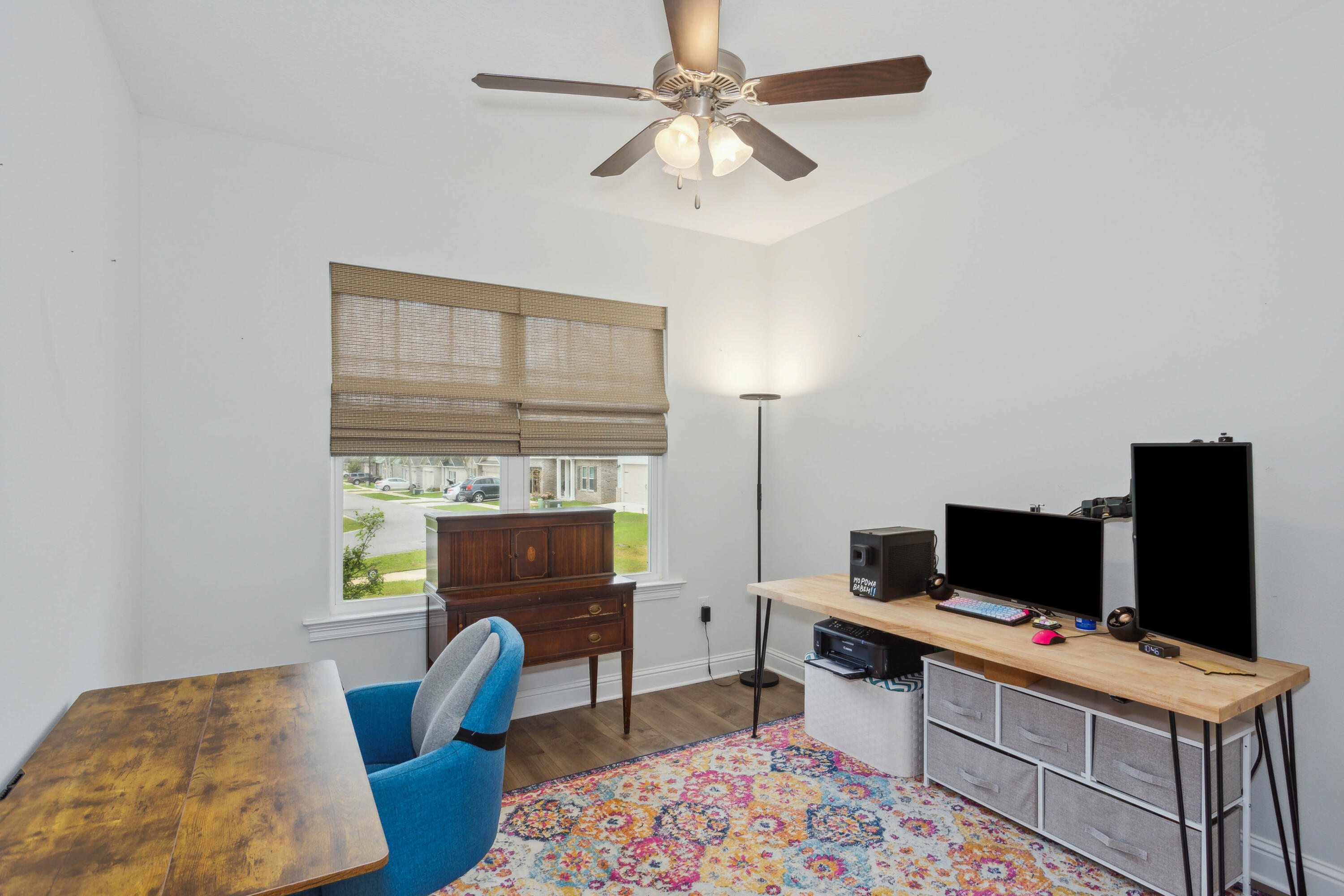 159 Laurel Oaks Drive Freeport, FL 32439 - Photo 26 of 34 a living room with furniture and a flat screen tv