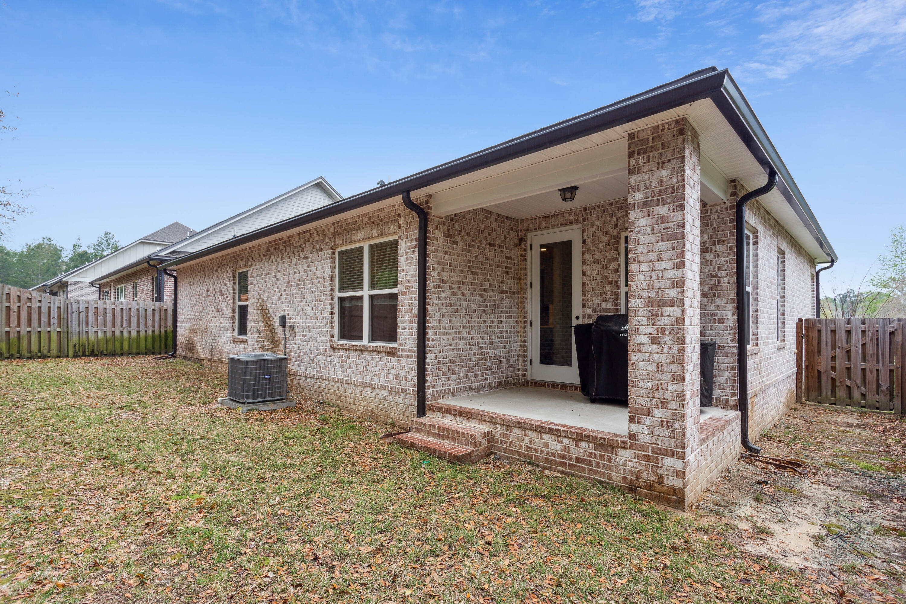 159 Laurel Oaks Drive Freeport, FL 32439 - Photo 29 of 34 a front view of a house with garden