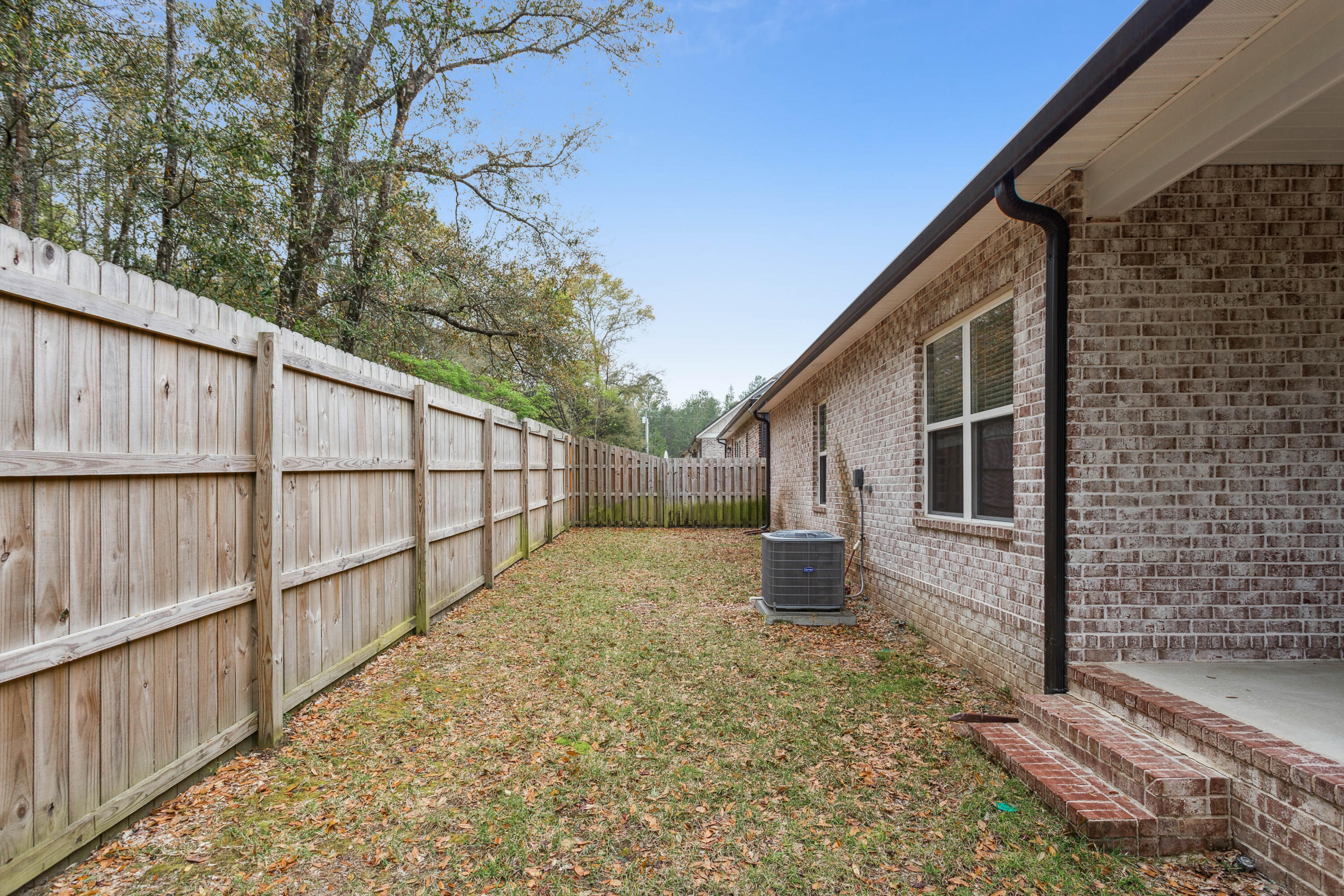159 Laurel Oaks Drive Freeport, FL 32439 - Photo 31 of 34 a view of a house with wooden fence