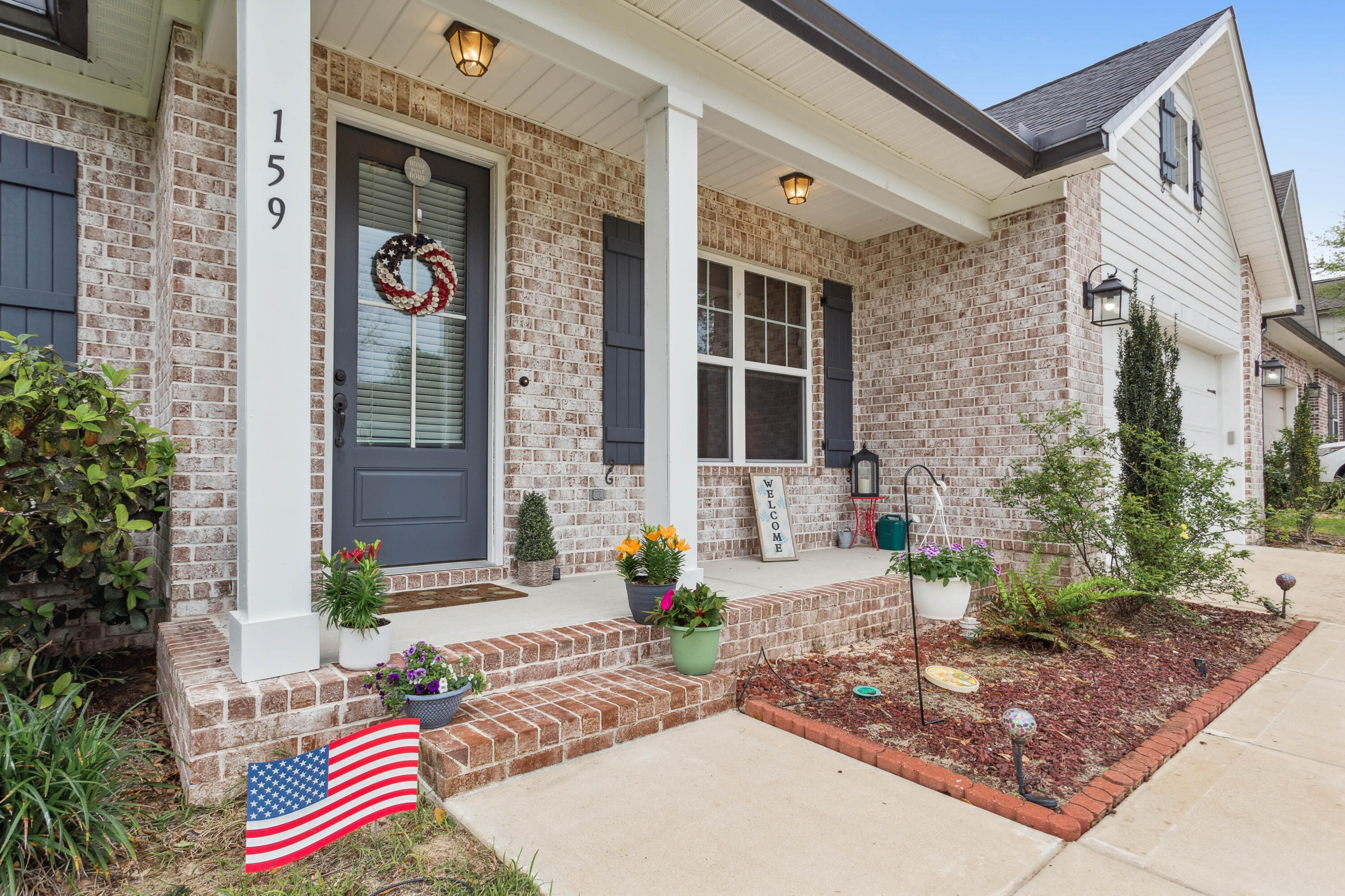 159 Laurel Oaks Drive Freeport, FL 32439 - Photo 4 of 34 a front view of a house with outdoor space