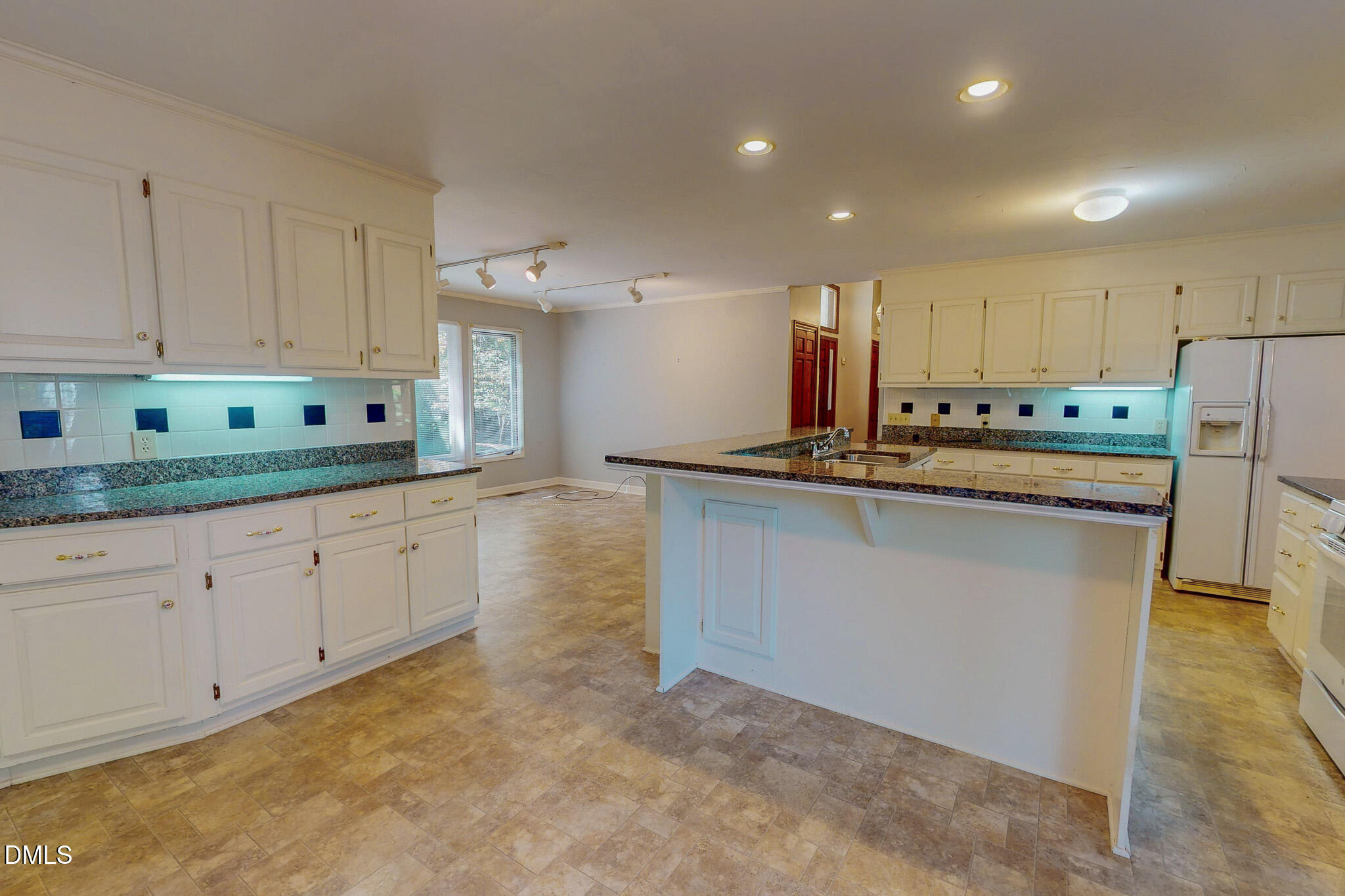 11 Denada Path Roxboro, NC 27574 - Photo 20 of 62 a kitchen that has a lot of white cabinets and stainless steel appliances