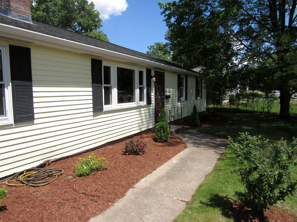 1247 Trapelo Road Waltham, MA 02451 - Photo 2 of 28 a front view of a house with garden