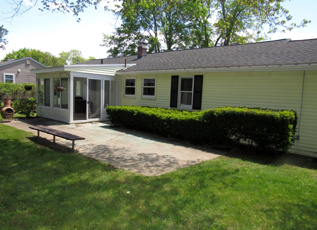 1247 Trapelo Road Waltham, MA 02451 - Photo 25 of 28 a front view of a house with a garden