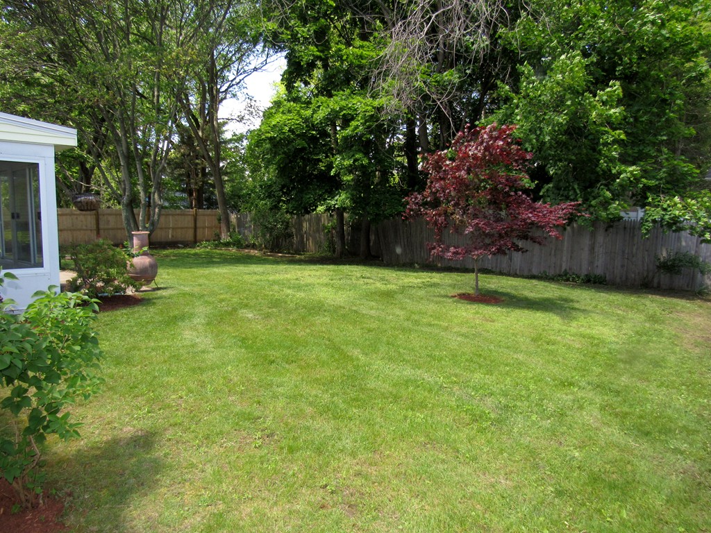 1247 Trapelo Road Waltham, MA 02451 - Photo 27 of 28 a view of a backyard with a garden