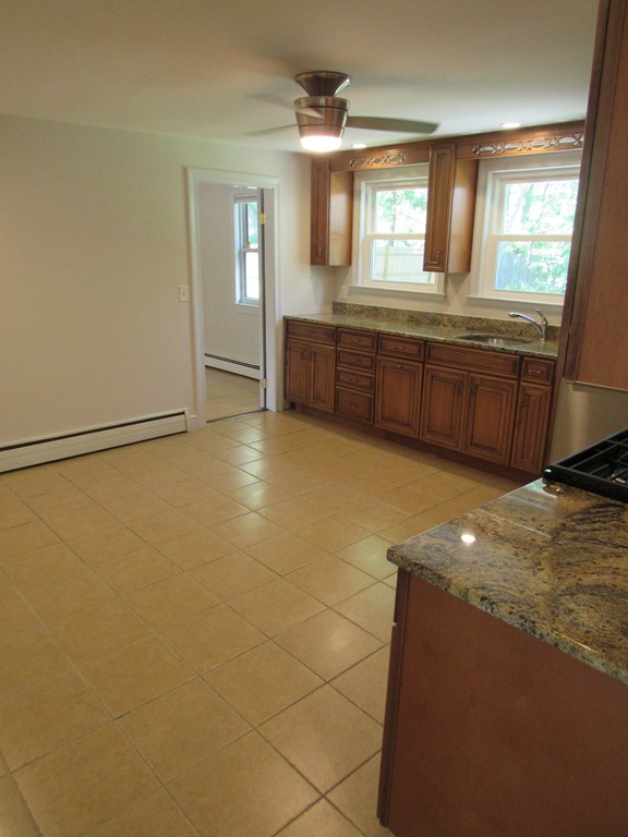 1247 Trapelo Road Waltham, MA 02451 - Photo 9 of 28 a view of a kitchen counter space and windows