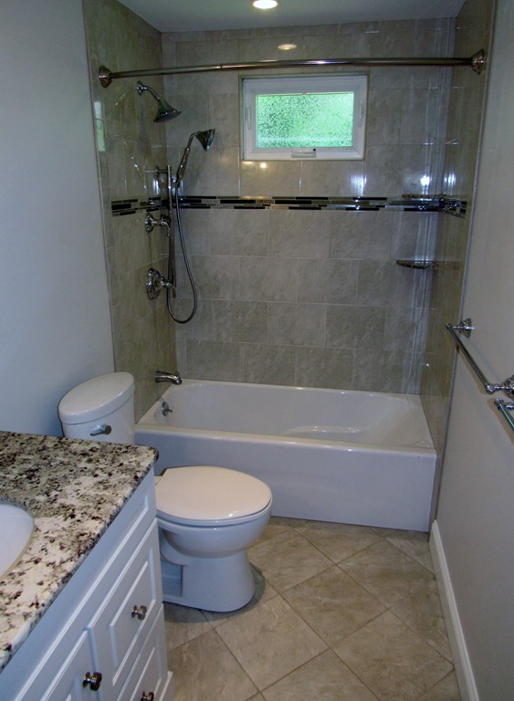 1247 Trapelo Road Waltham, MA 02451 - Photo 10 of 28 a bathroom with a granite countertop sink toilet and shower