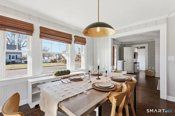 a view of a dining room with furniture window and wooden floor