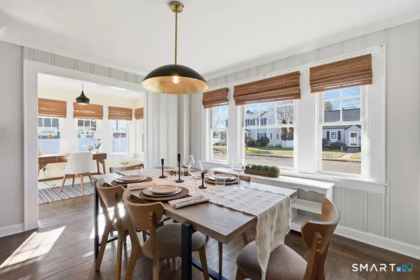 a view of a dining room with furniture window and outside view