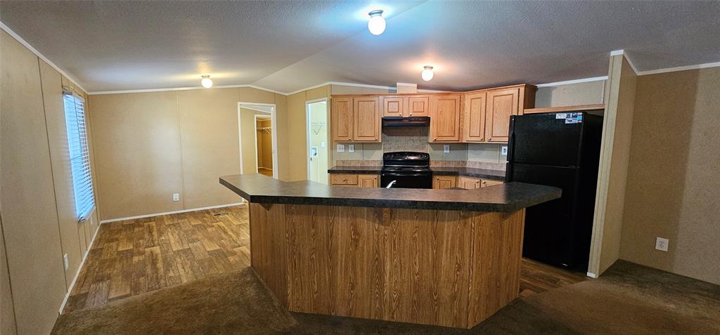 434 Geronimo Quitman, TX 75783 - Photo 12 of 36 a kitchen with stainless steel appliances a refrigerator and a stove