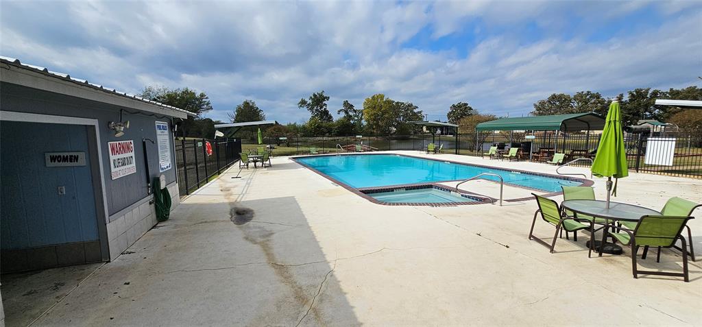 434 Geronimo Quitman, TX 75783 - Photo 31 of 36 a swimming pool with outdoor seating and barbeque in the back yard