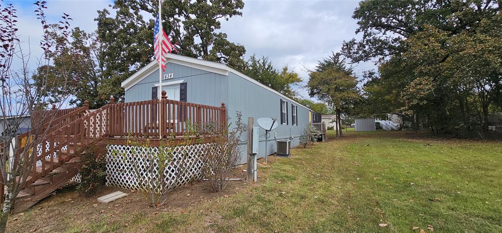 434 Geronimo Quitman, TX 75783 - Photo 4 of 36 a front view of a house with garden