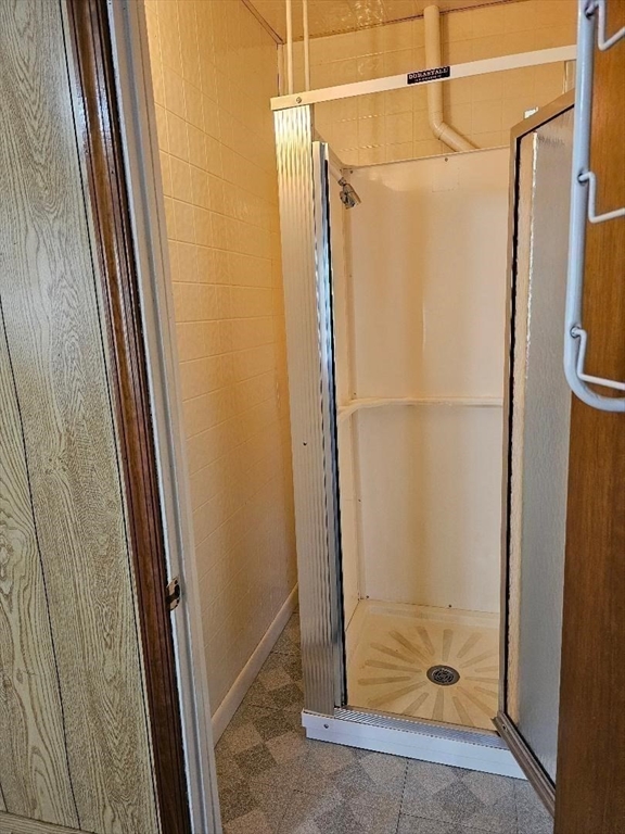339 Harrison Street, Unit 1N Fall River, MA 02723 - Photo 11 of 14 a bathroom with a glass door shower