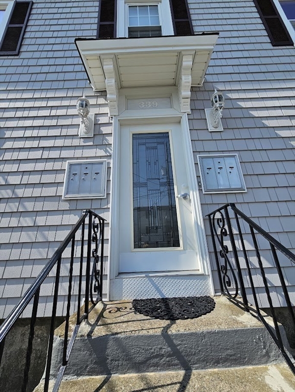 339 Harrison Street, Unit 1N Fall River, MA 02723 - Photo 14 of 14 a front view of a house with stairs