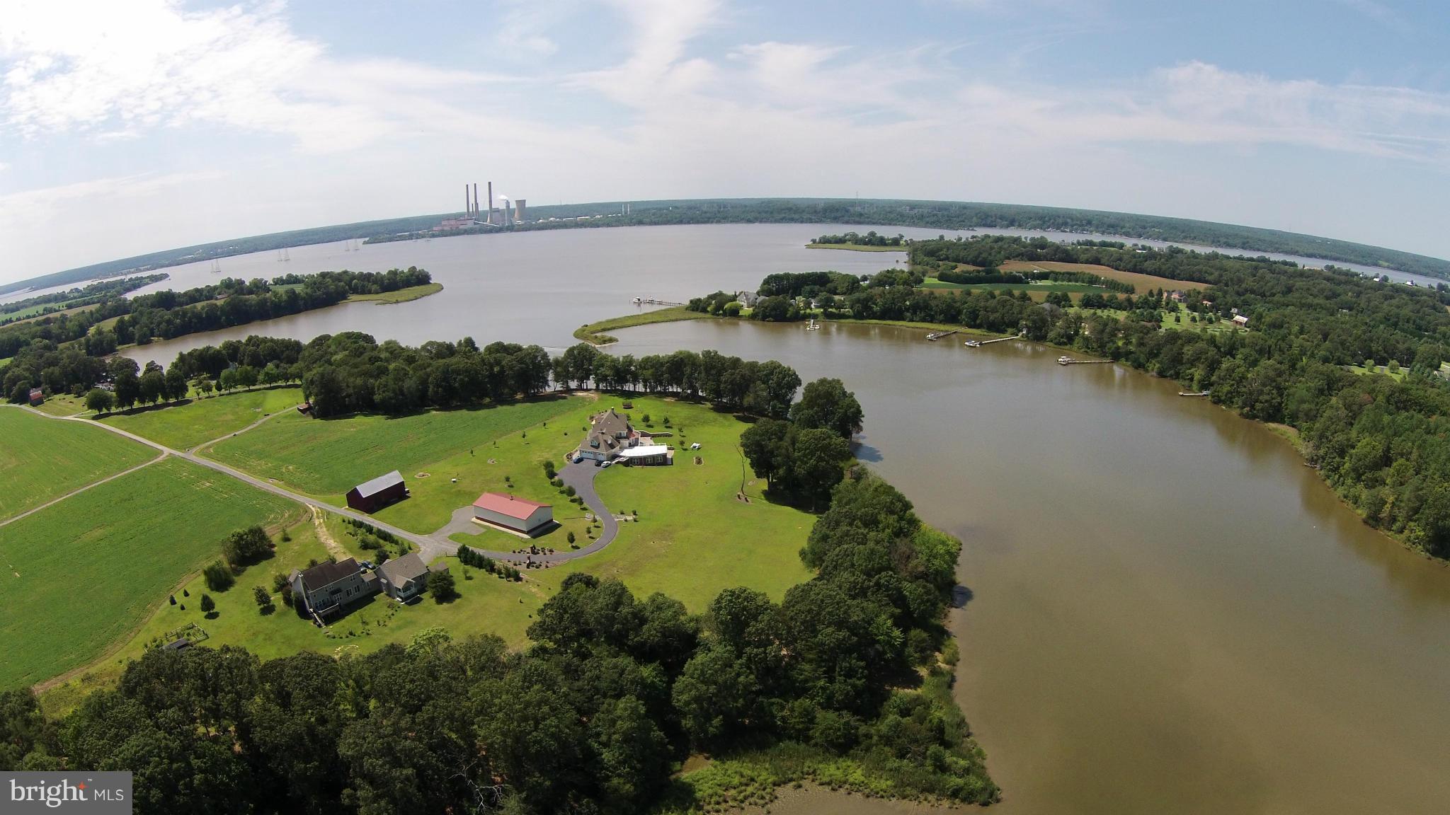 2071 Lowery Road Huntingtown, MD 20639 - Photo 1 of 27 an aerial view of a city and lake view