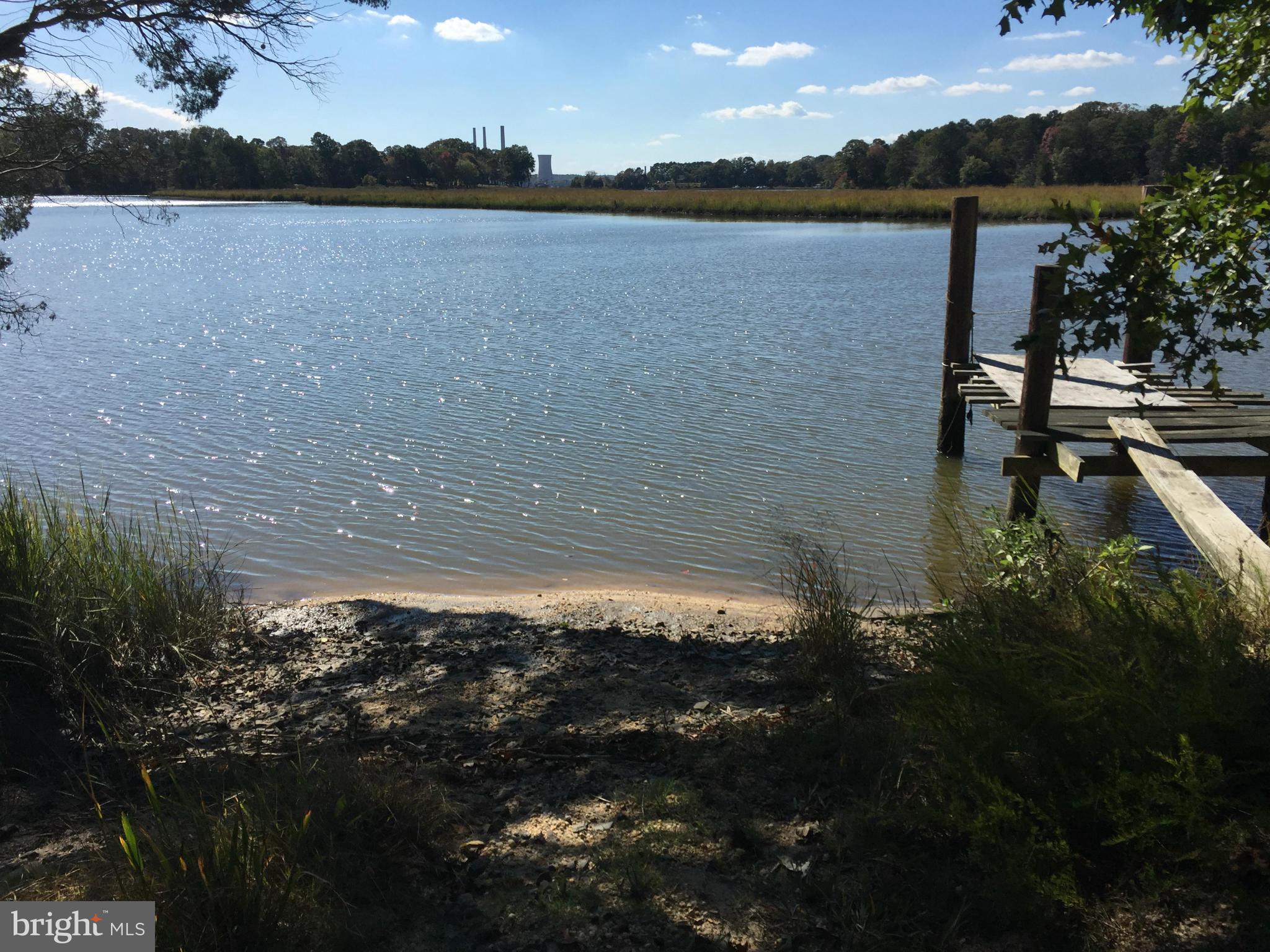 2071 Lowery Road Huntingtown, MD 20639 - Photo 2 of 27 a view of a lake in middle of forest