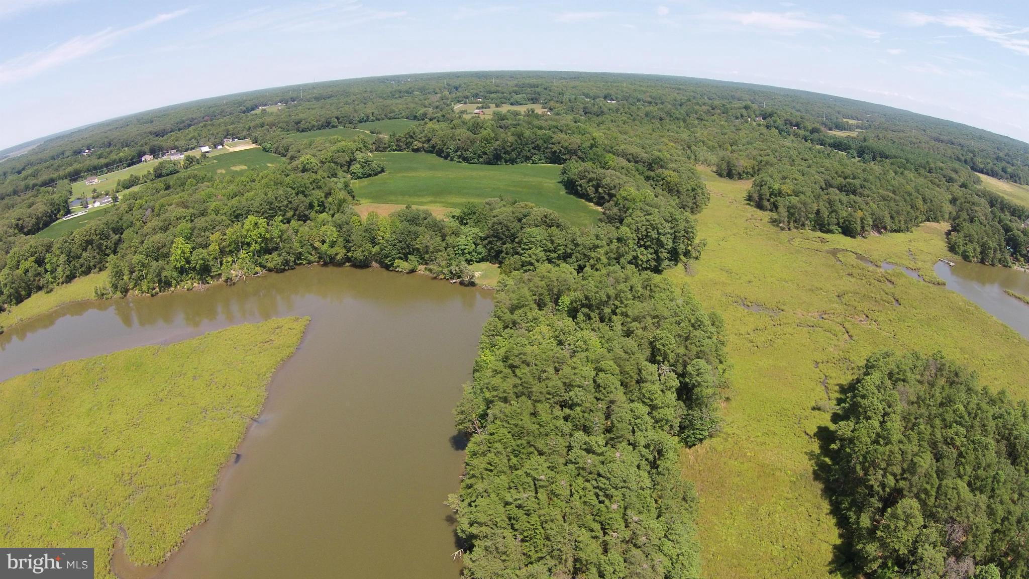 2071 Lowery Road Huntingtown, MD 20639 - Photo 20 of 27 a view of a lake with a mountain in the background