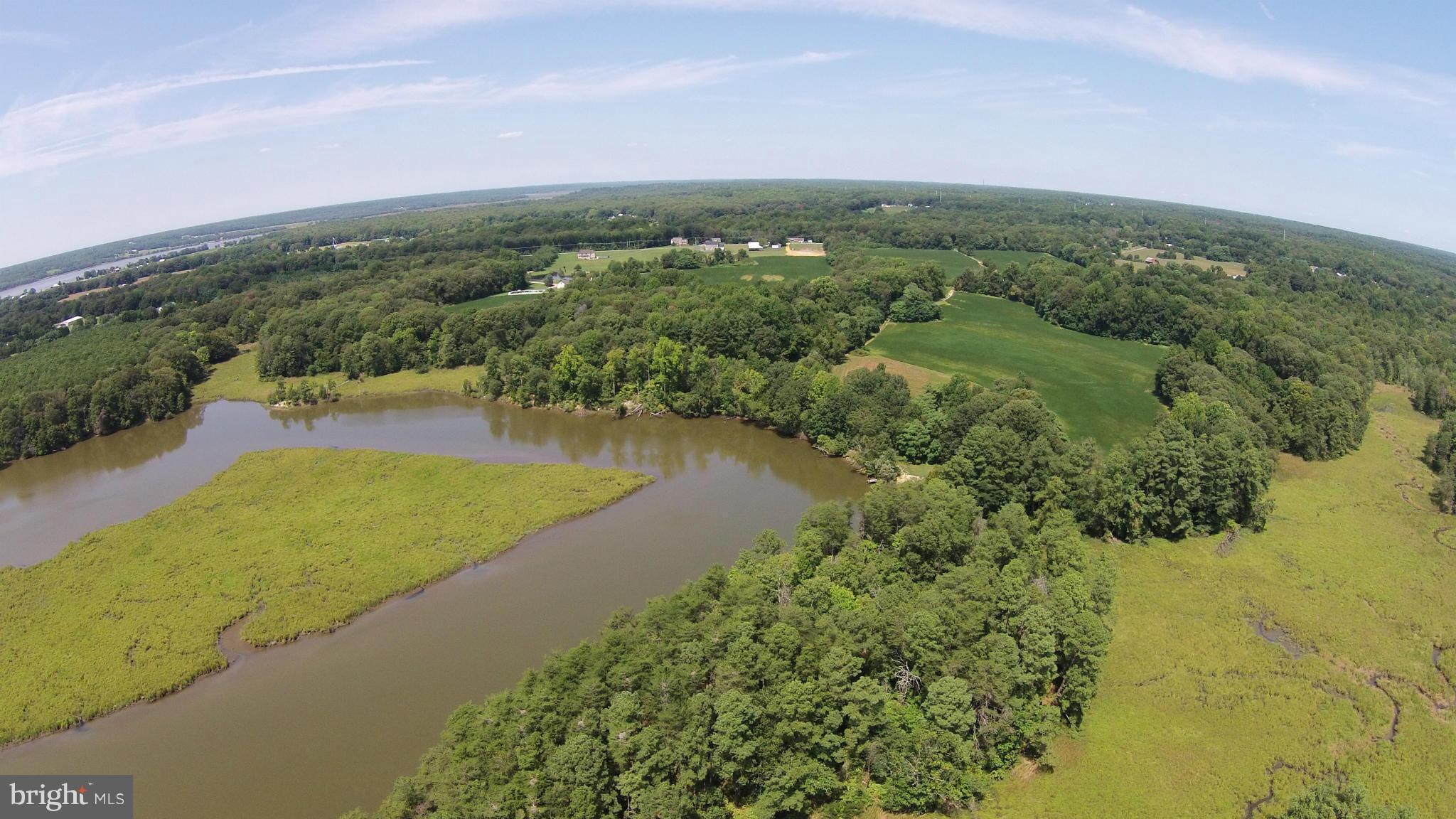 2071 Lowery Road Huntingtown, MD 20639 - Photo 21 of 27 a view of a lake with a yard