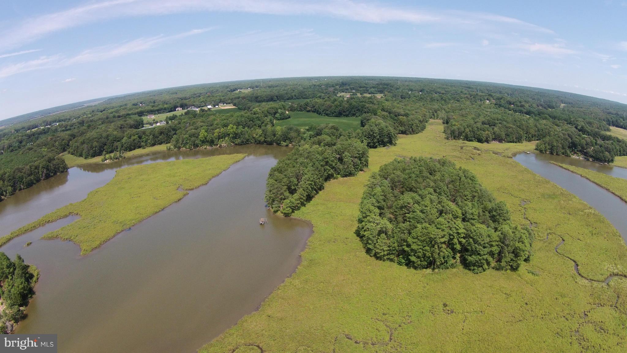 2071 Lowery Road Huntingtown, MD 20639 - Photo 22 of 27 a view of a lake with a yard