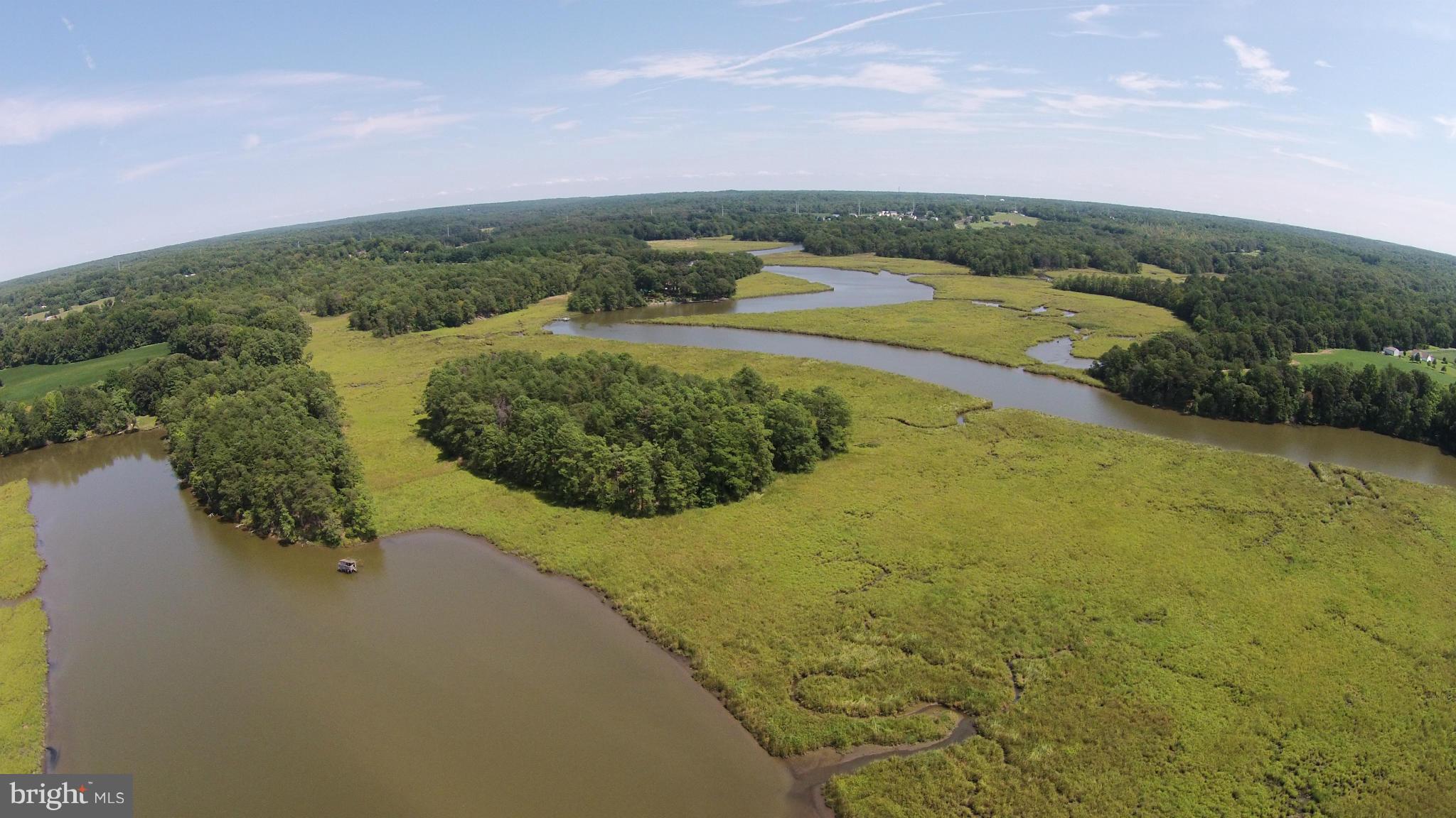2071 Lowery Road Huntingtown, MD 20639 - Photo 23 of 27 a view of a lake with a mountain in the background