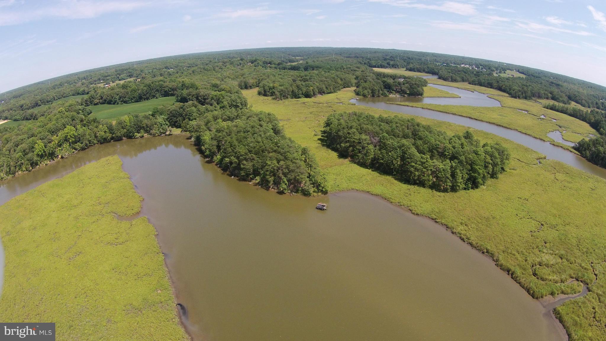2071 Lowery Road Huntingtown, MD 20639 - Photo 24 of 27 a view of a lake with a yard