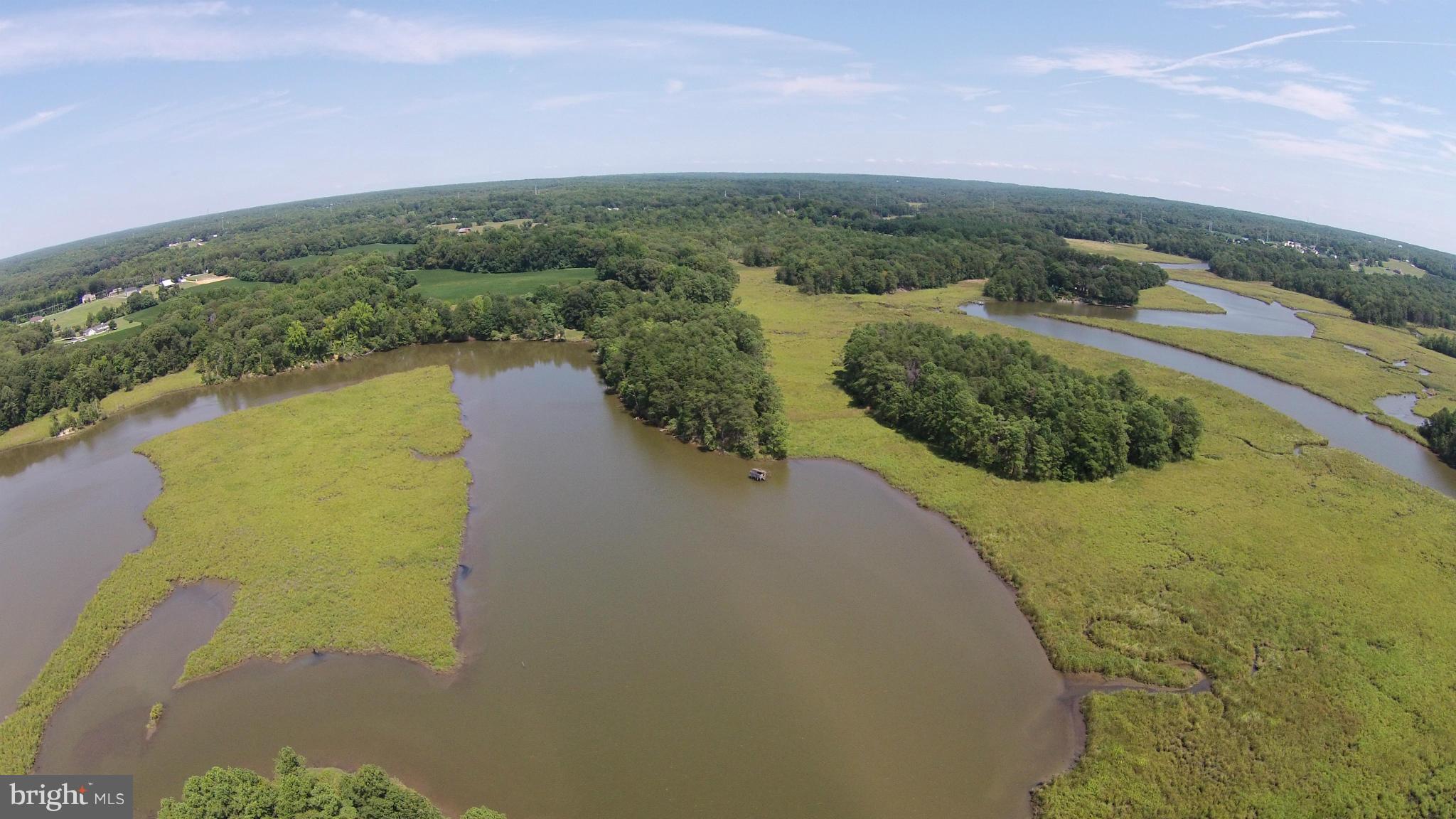 2071 Lowery Road Huntingtown, MD 20639 - Photo 27 of 27 a view of a lake with a mountain in the background