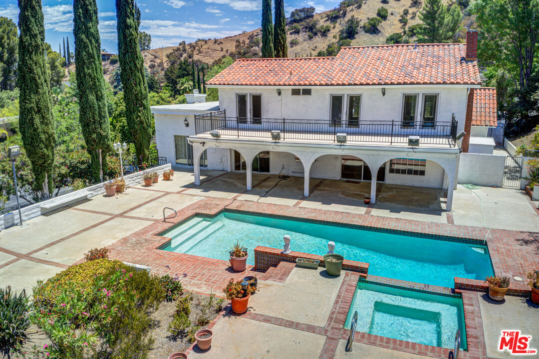 4041 Alonzo Avenue Encino, CA 91316 - Photo 1 of 41 a view of a patio with table and chairs with wooden fence