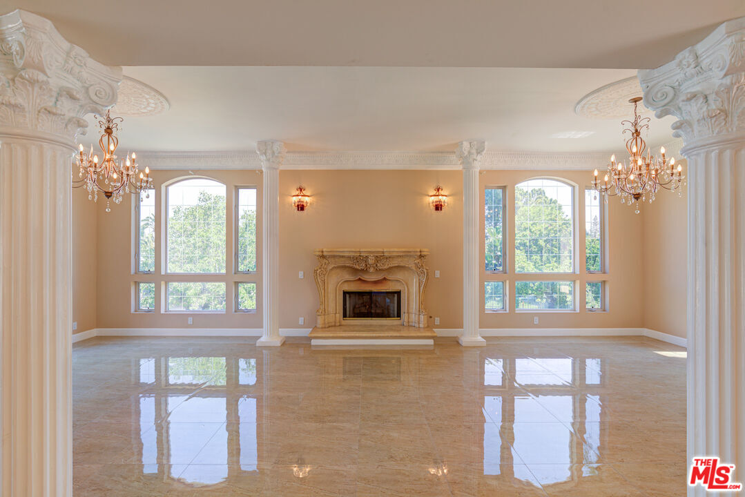 4041 Alonzo Avenue Encino, CA 91316 - Photo 14 of 41 a view of a livingroom with a fireplace and large windows