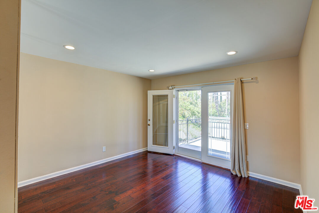4041 Alonzo Avenue Encino, CA 91316 - Photo 20 of 41 a view of an empty room with wooden floor and a window