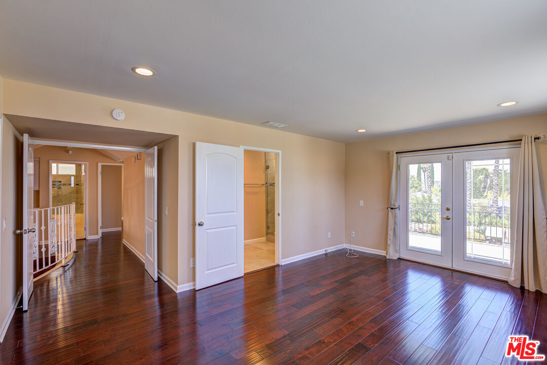 4041 Alonzo Avenue Encino, CA 91316 - Photo 25 of 41 a view of an empty room with wooden floor and a window