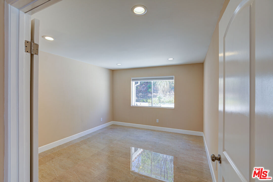 4041 Alonzo Avenue Encino, CA 91316 - Photo 28 of 41 an empty room with windows and closet