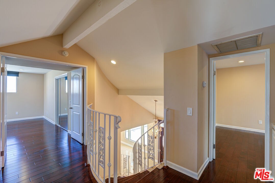 4041 Alonzo Avenue Encino, CA 91316 - Photo 29 of 41 a view of a hallway with wooden floor and staircase
