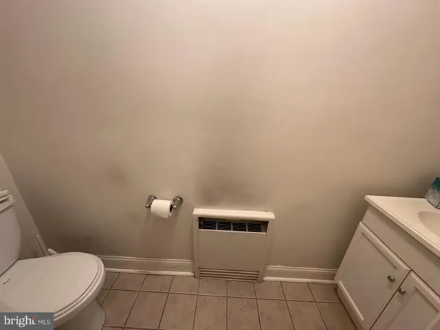a bathroom with a toilet and a sink