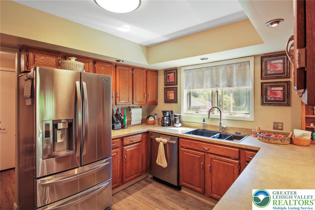 3470 Brodhead Road Bethlehem, PA 18020 - Photo 45 of 84 A well-equipped kitchen features wooden cabinetry, durable countertops, and modern stainless steel appliances.