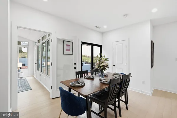 a view of a dining room with furniture and window