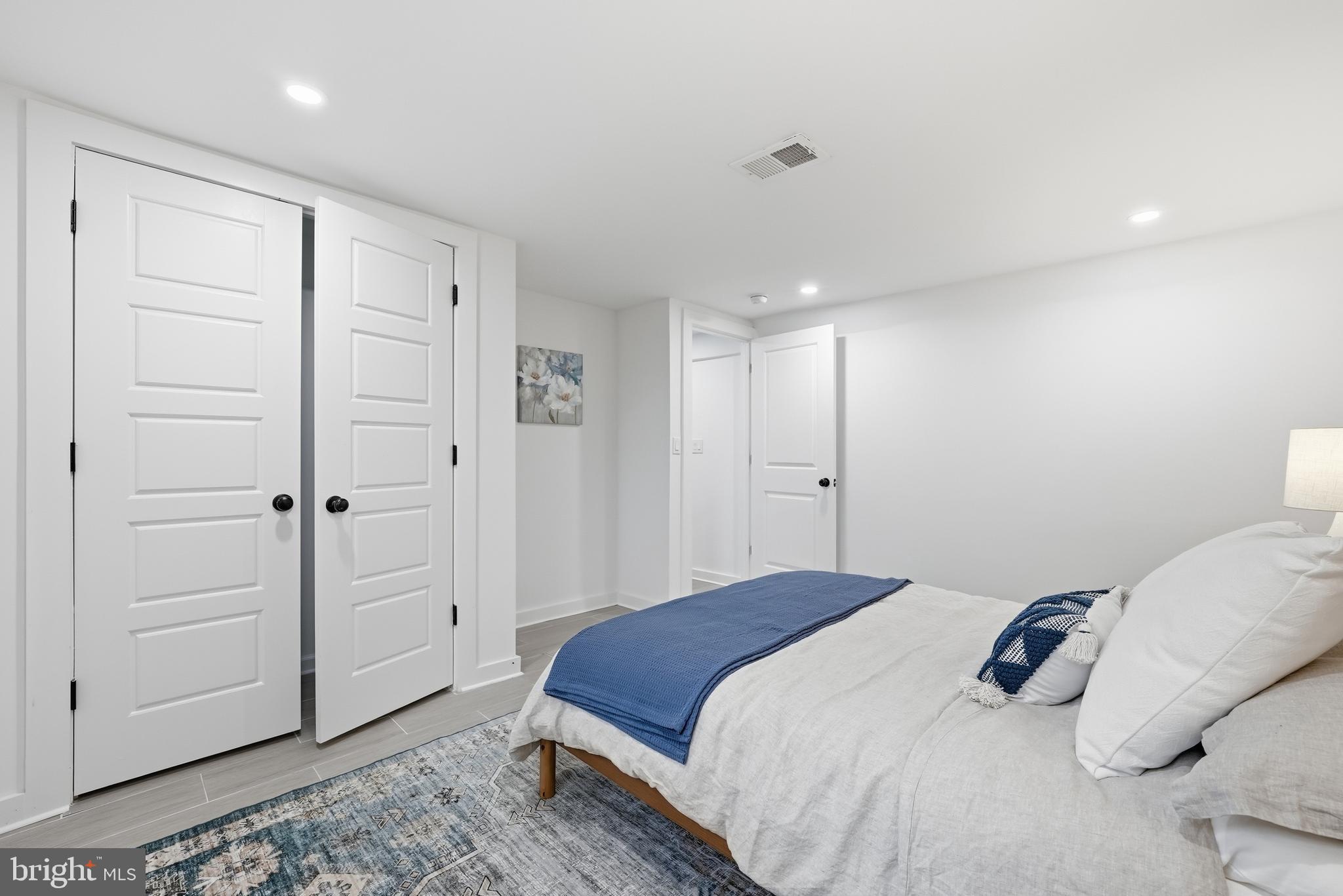 2211 Franklin Street Northeast Washington, DC 20018 - Photo 28 of 39 a bedroom with a bed and a closet
