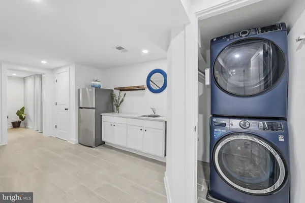 a view of a storage & utility room with washer and dryer