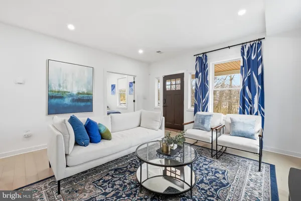 a living room with furniture and a rug