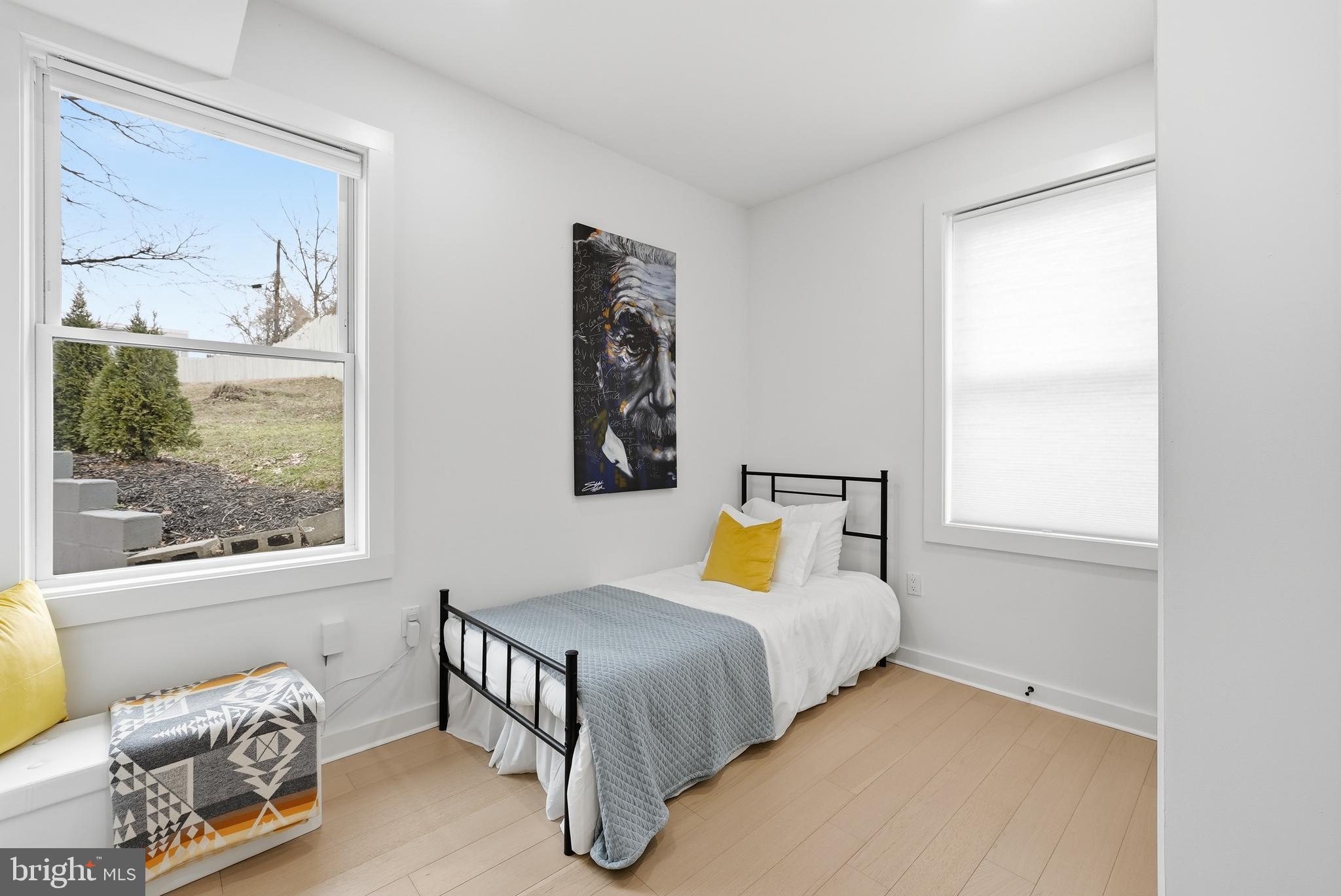 2211 Franklin Street Northeast Washington, DC 20018 - Photo 10 of 39 a bedroom with a bed and a window